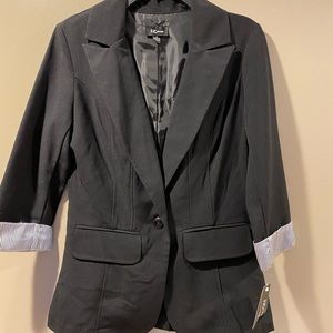 Woman’s fitted blazer with pin stripe lining